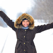 A young woman wearing a winter jacket in winter.